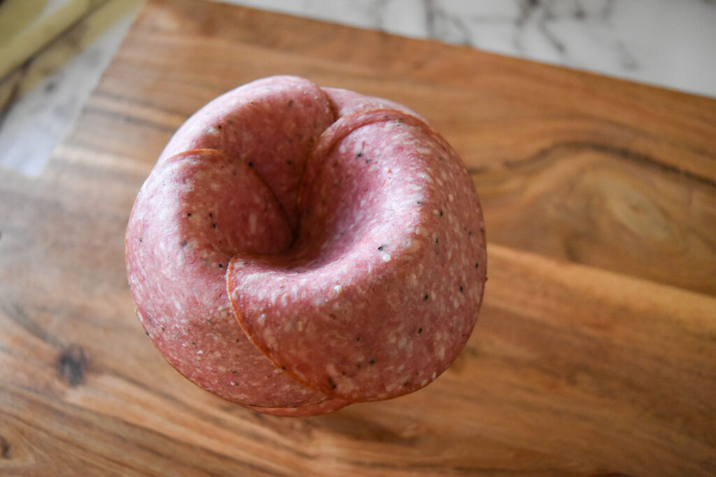 Salami Rose Step 3: Continue layering the salami until the whole in the middle disappears and you can't add anymore.