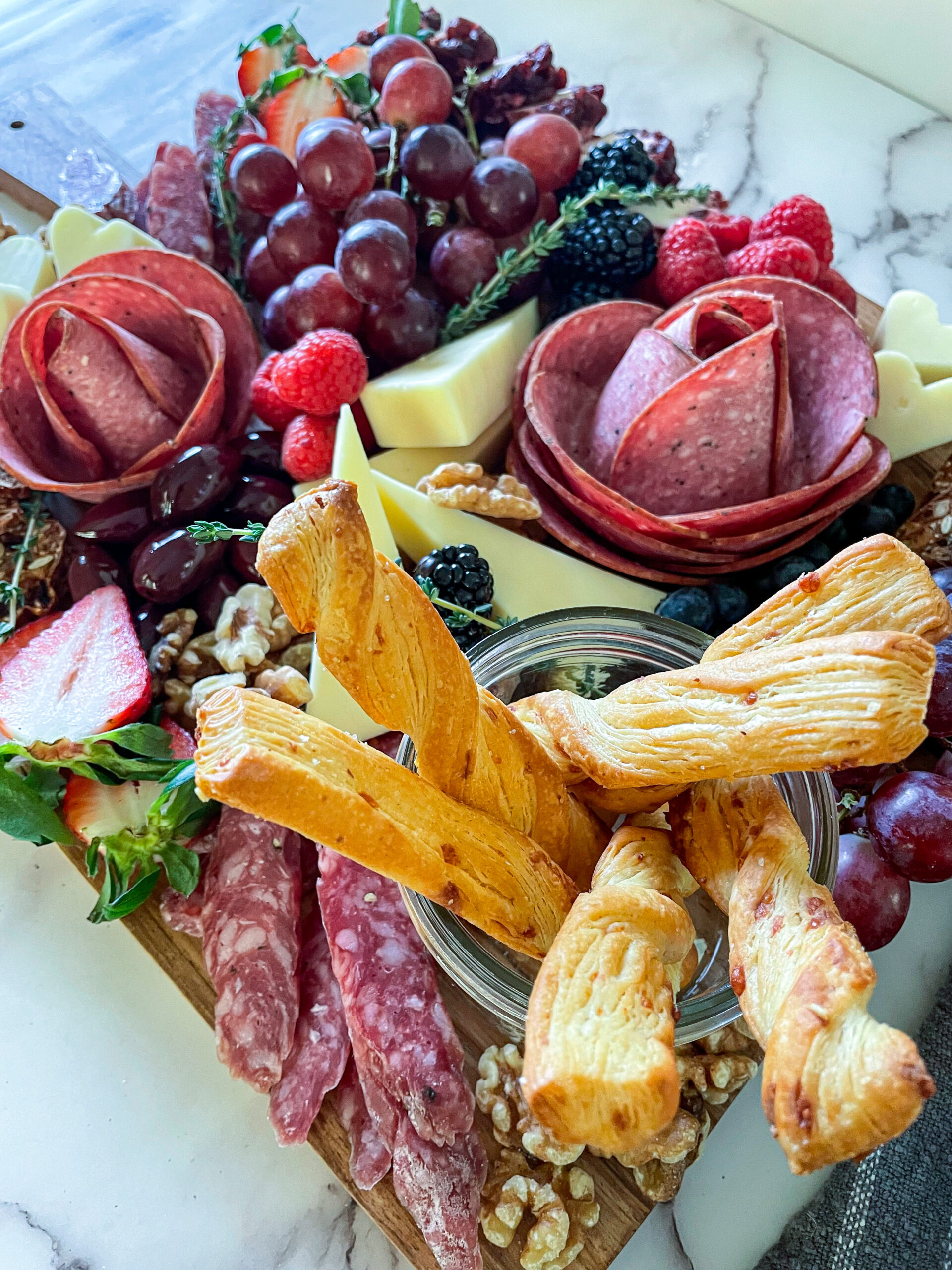 How to Eat a Salami Rose. Meat Rose served on a charcuterie board.